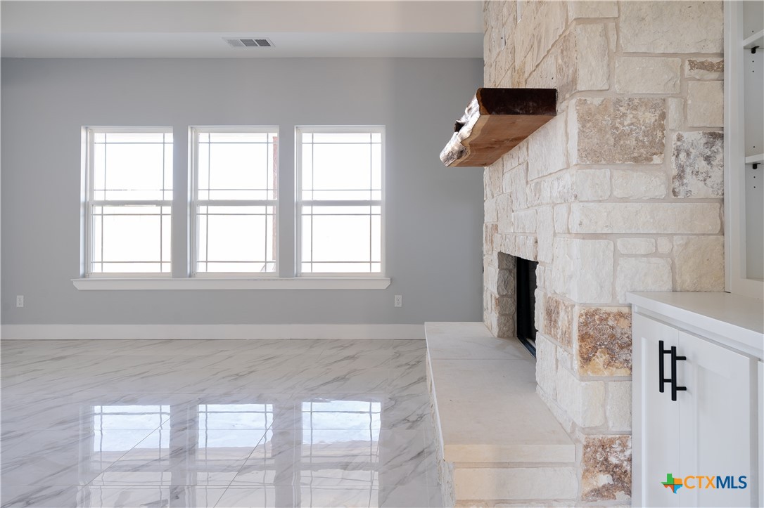 1000 Black Ankle Road Lockhart, TX 78644 - Photo 21 of 40 a view of an empty room with window and cabinet