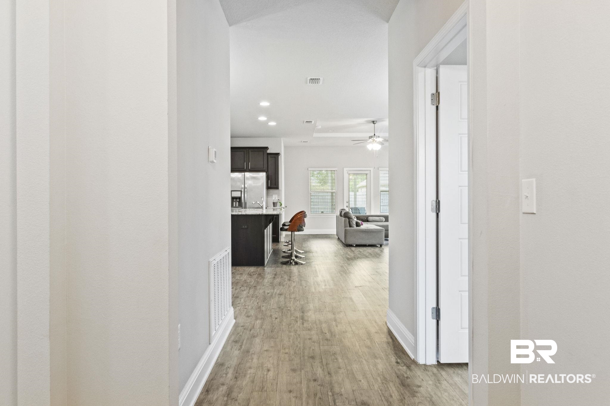 31643 Kestrel Loop Daphne, AL 36527 - Photo 4 of 59 Hallway featuring light wood-type flooring