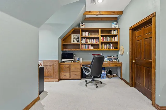 a view of a workspace with furniture