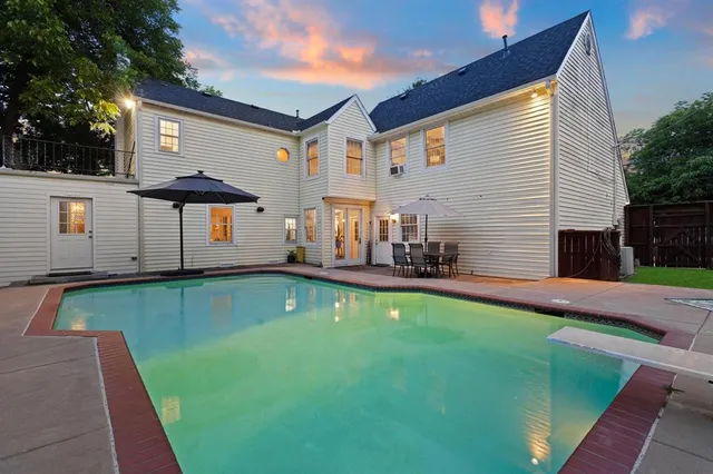 a front view of house with yard and outdoor seating