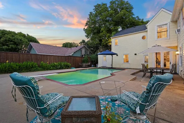 a patio with table and chairs