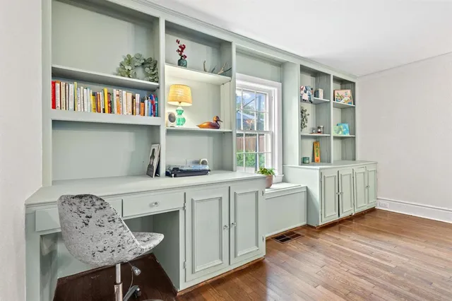 a room with furniture a rug and a window