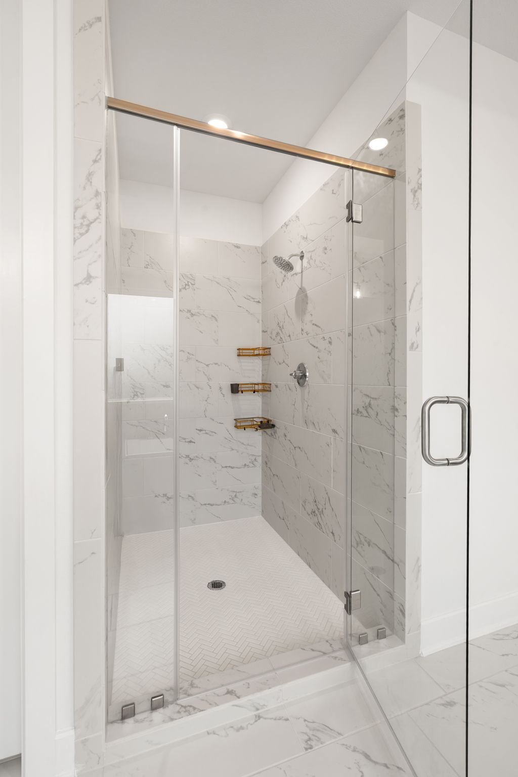 515 Watershield Cove Georgetown, TX 78633 - Photo 21 of 40 A frameless glass shower enclosure creates an open, spa-like atmosphere.