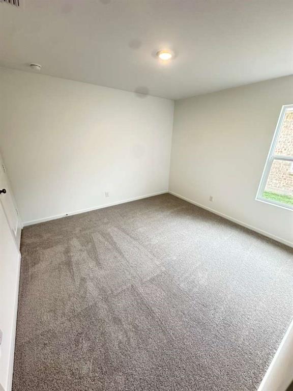11570 Antrrim Place Place Rhome, TX 76078 - Photo 11 of 17 an empty room with a window