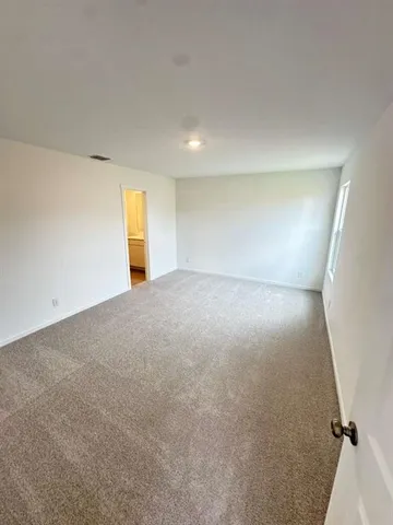 a view of wooden floor in an empty room