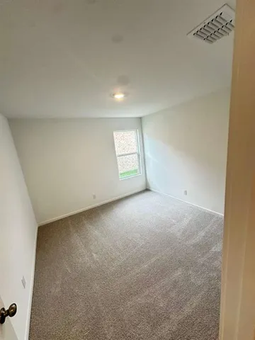 a bathroom with a toilet and a bathtub