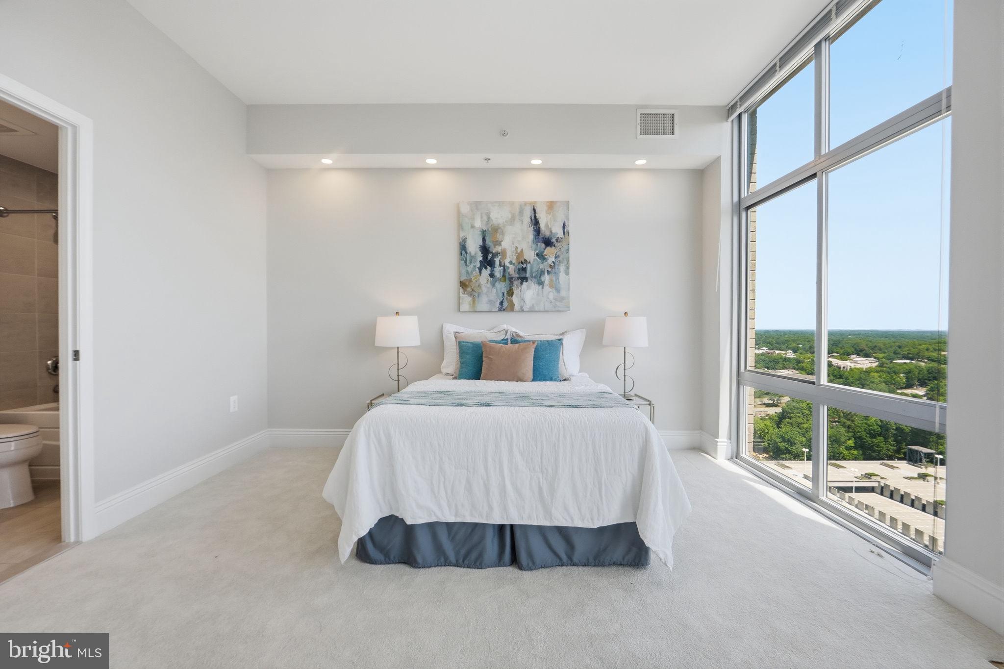 11990 Market Street, Unit 2103 Reston, VA 20190 - Photo 39 of 78 Serene bedroom with stunning views.
