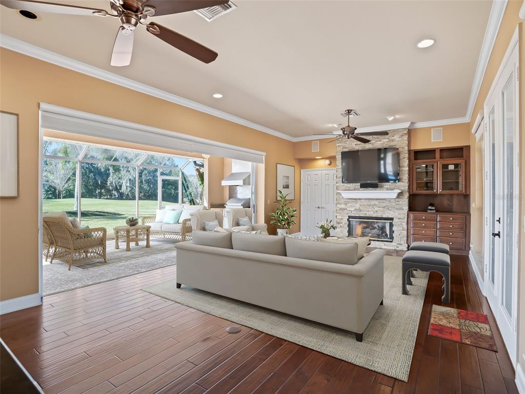 1412 Meadow View Way Lady Lake, FL 32159 - Photo 13 of 37 a living room with furniture and a fireplace