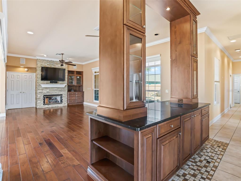 1412 Meadow View Way Lady Lake, FL 32159 - Photo 16 of 37 a kitchen with stainless steel appliances a stove and cabinets