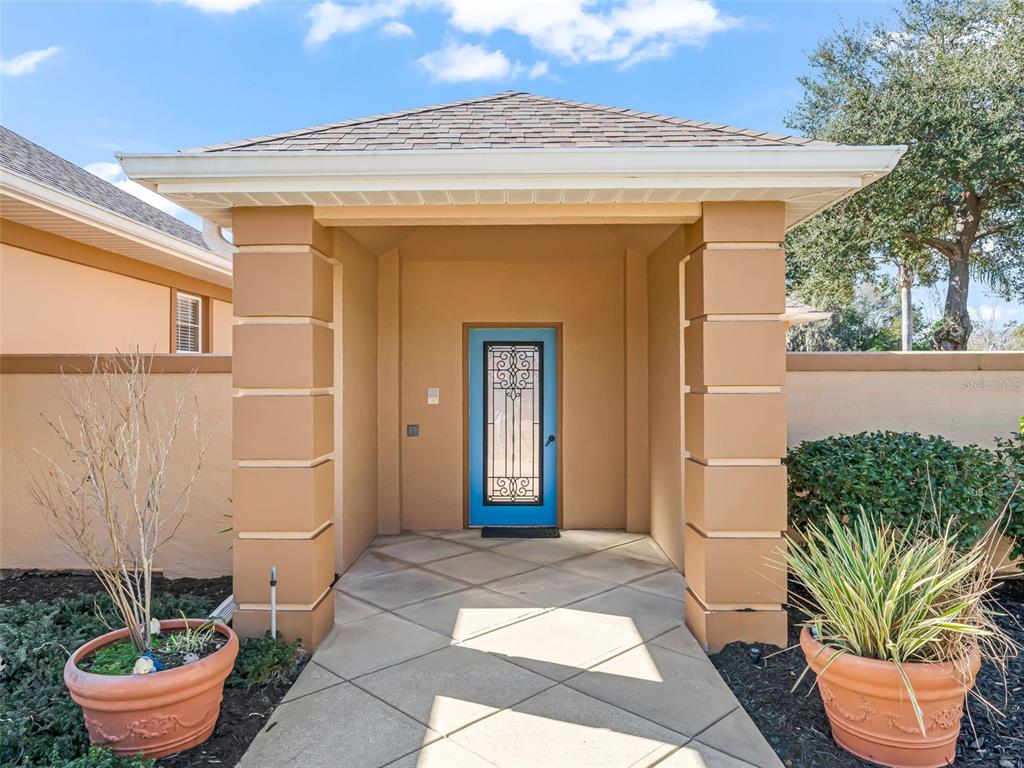 1412 Meadow View Way Lady Lake, FL 32159 - Photo 2 of 37 a front view of a house with a garden