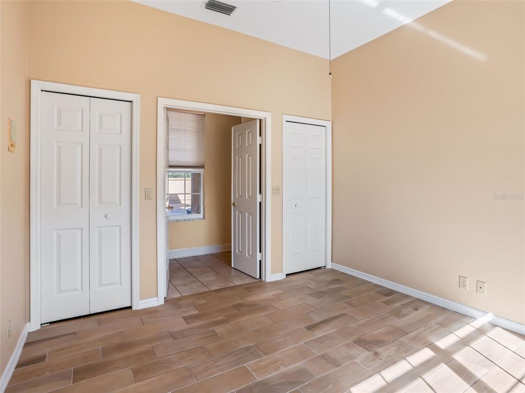 1412 Meadow View Way Lady Lake, FL 32159 - Photo 24 of 37 an empty room with windows and closet