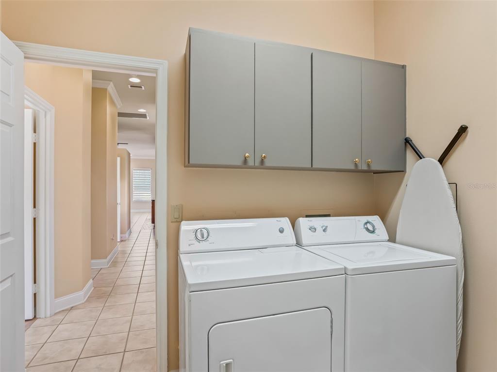 1412 Meadow View Way Lady Lake, FL 32159 - Photo 32 of 37 a utility room with dryer and washer