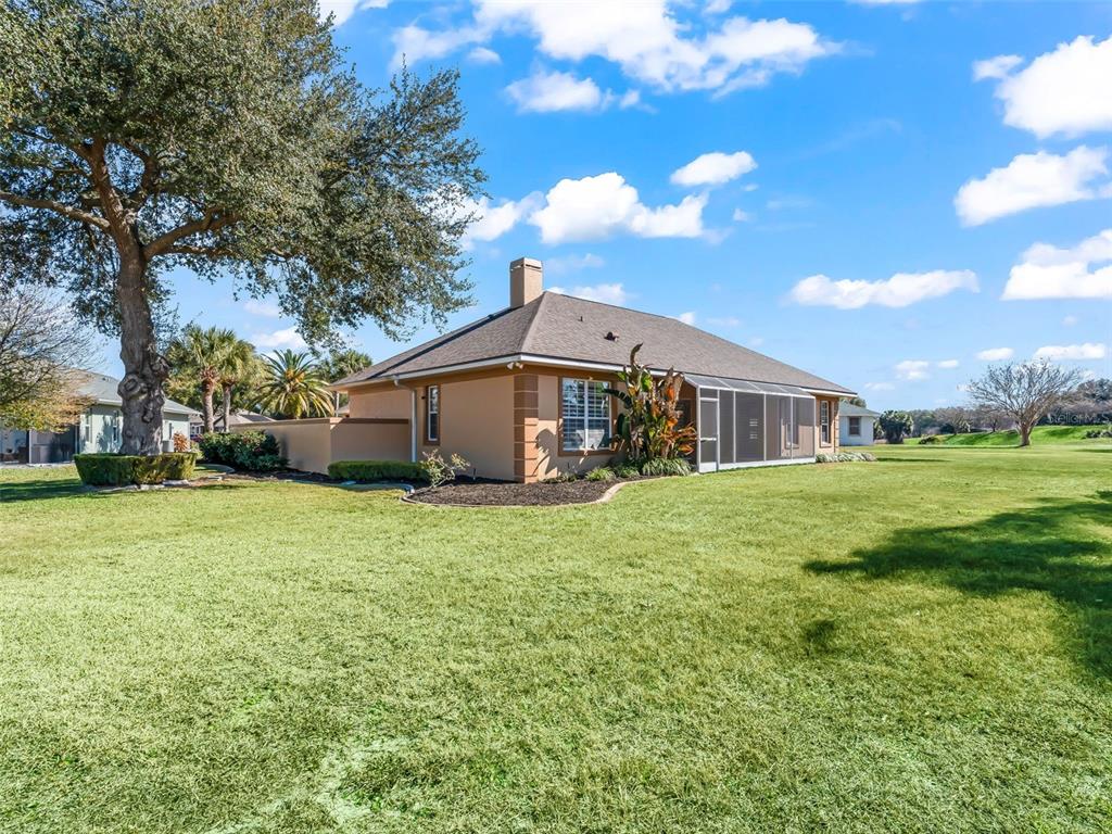 1412 Meadow View Way Lady Lake, FL 32159 - Photo 35 of 37 a front view of house with yard and green space
