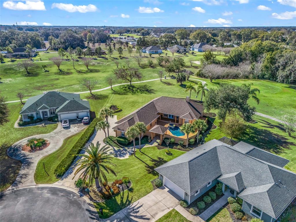 1412 Meadow View Way Lady Lake, FL 32159 - Photo 37 of 37 an aerial view of a house with a garden