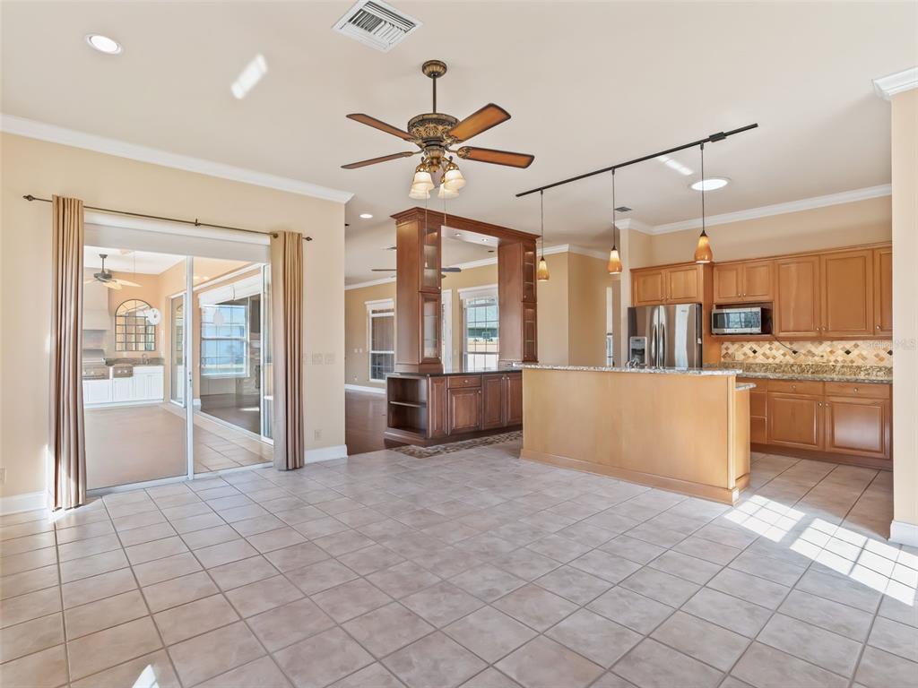 1412 Meadow View Way Lady Lake, FL 32159 - Photo 10 of 37 a view of a kitchen with furniture and a kitchen