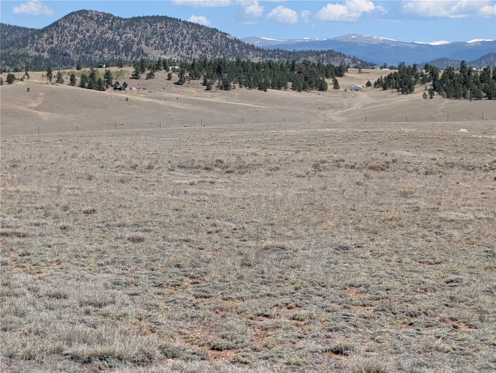 412 Andesite Way Como, CO 80432 - Photo 18 of 22 a view of dirt road with a building in the background