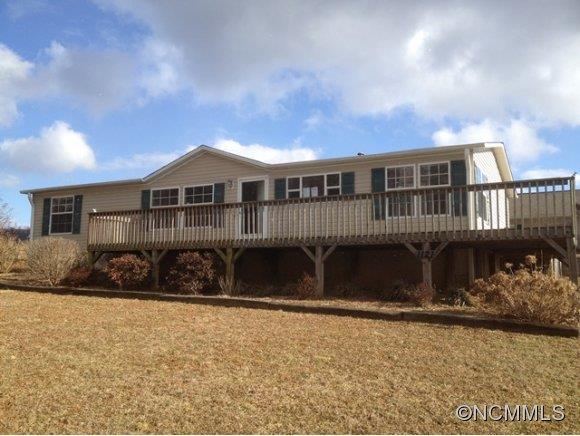 1121 Kerr Road Hendersonville, NC 28792 - Photo 1 of 10 front view of a house with a yard