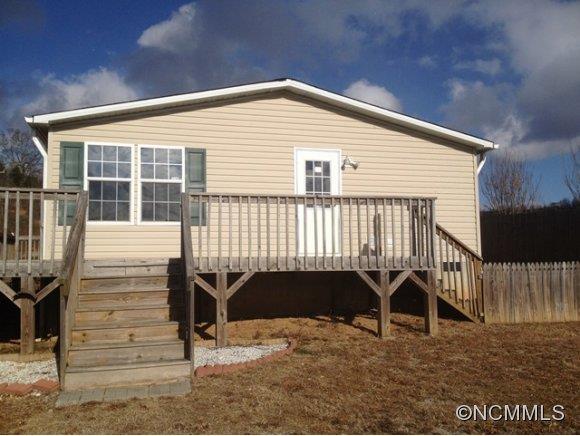 1121 Kerr Road Hendersonville, NC 28792 - Photo 2 of 10 a view of a house with a balcony