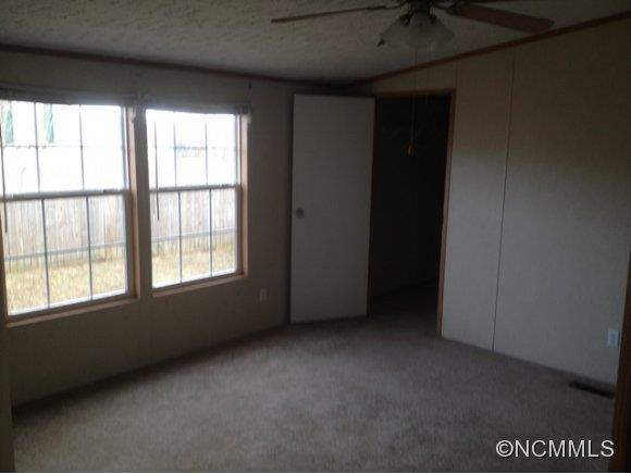 1121 Kerr Road Hendersonville, NC 28792 - Photo 8 of 10 an empty room with a window