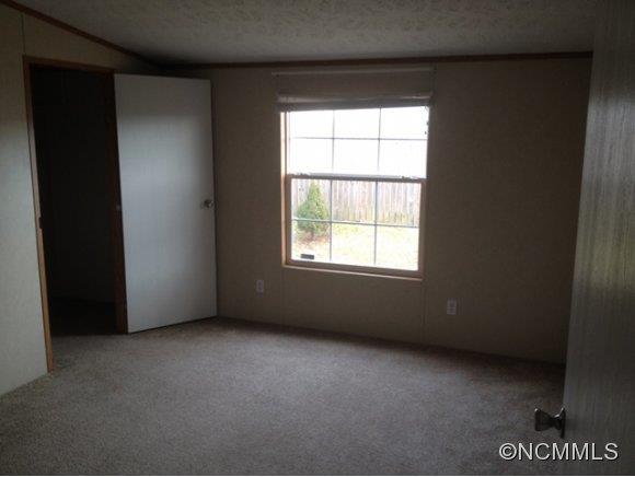 1121 Kerr Road Hendersonville, NC 28792 - Photo 9 of 10 an empty room with a window