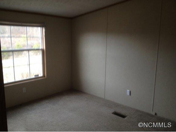 1121 Kerr Road Hendersonville, NC 28792 - Photo 10 of 10 an empty room with a window