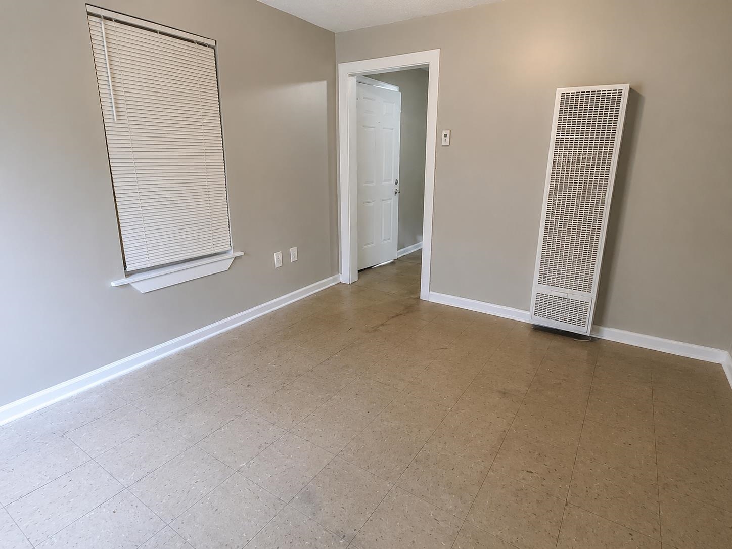 1672 Clancy Street Memphis, TN 38106 - Photo 4 of 7 Neutral-toned walls complement the tile flooring