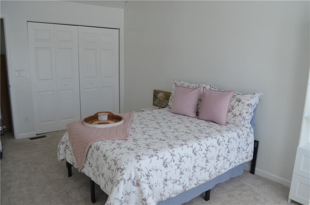 515 Galileo Drive Rostraver Township, PA 15012 - Photo 21 of 43 a bedroom with a bed and a window