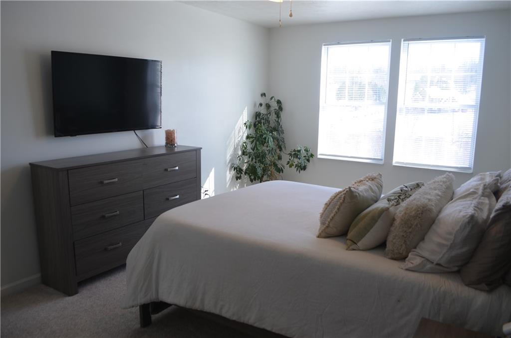 515 Galileo Drive Rostraver Township, PA 15012 - Photo 27 of 43 a bedroom with a bed and a flat screen tv