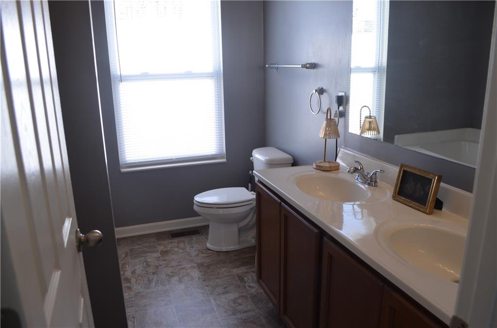 515 Galileo Drive Rostraver Township, PA 15012 - Photo 29 of 43 a bathroom with a sink toilet and mirror