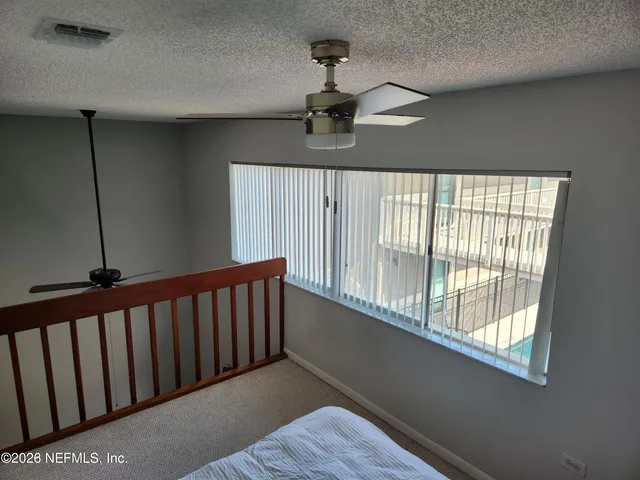 an empty room with large window