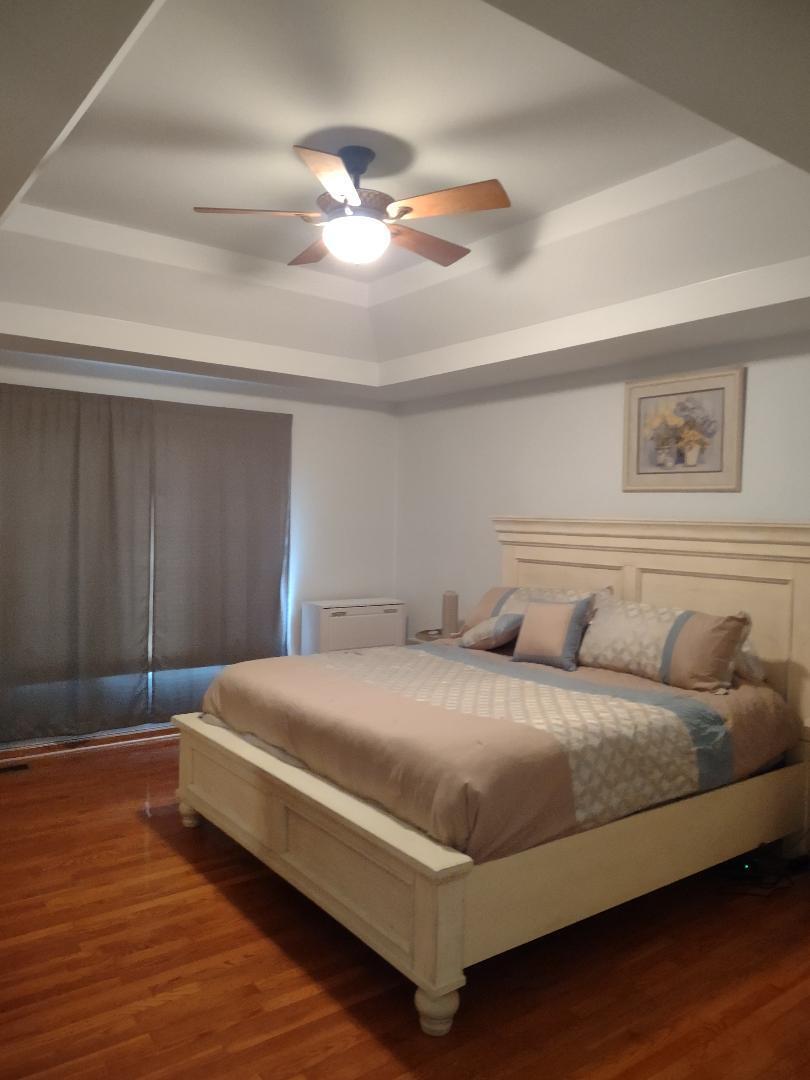 9800 Crestwood Circle Demotte, IN 46310 - Photo 12 of 25 a bedroom with a bed and lamp