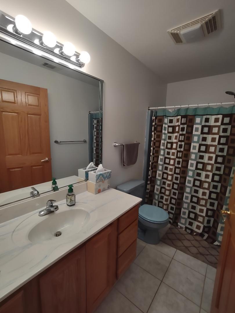 9800 Crestwood Circle Demotte, IN 46310 - Photo 20 of 25 a bathroom with a sink toilet and shower