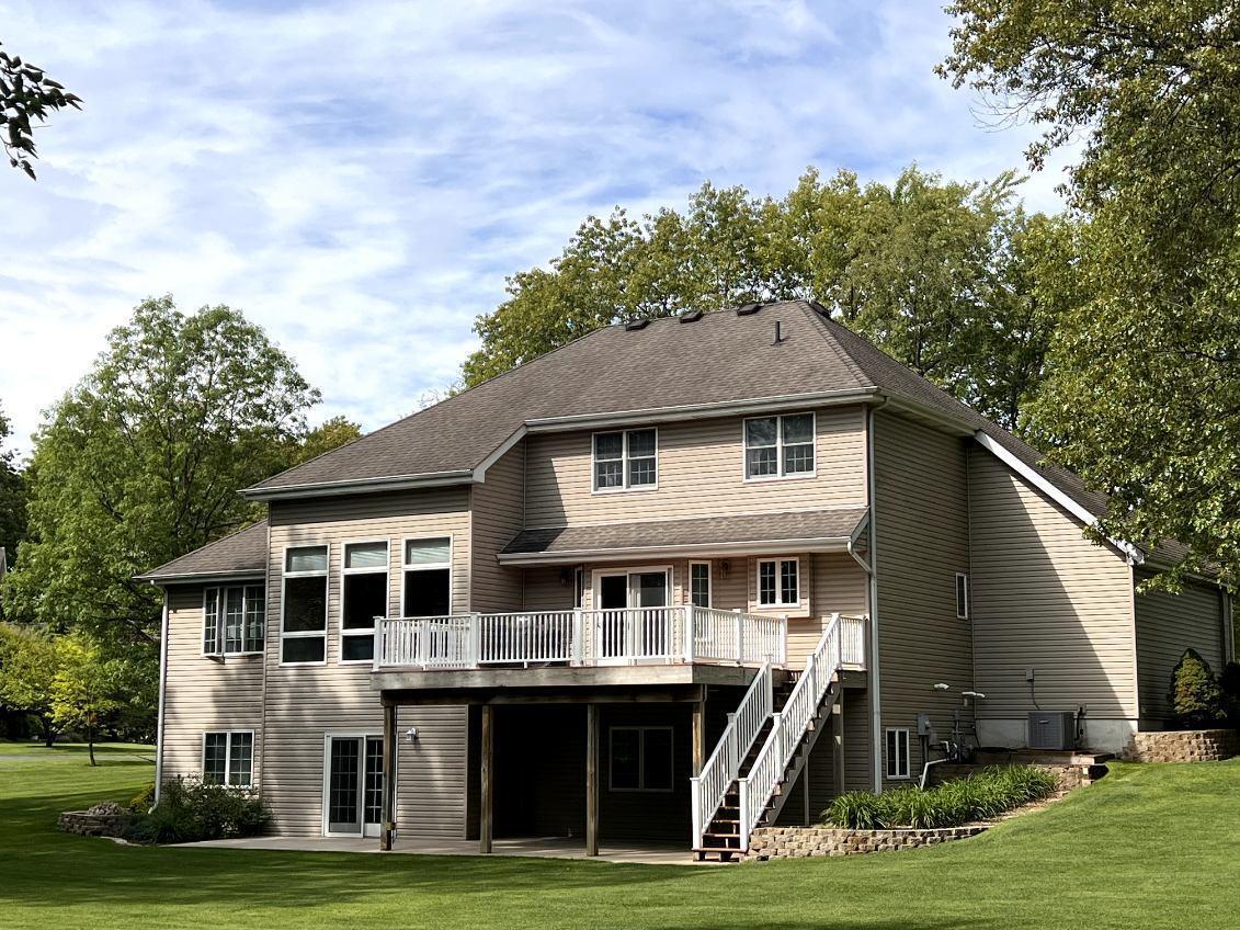 9800 Crestwood Circle Demotte, IN 46310 - Photo 3 of 25 a front view of a house with a yard