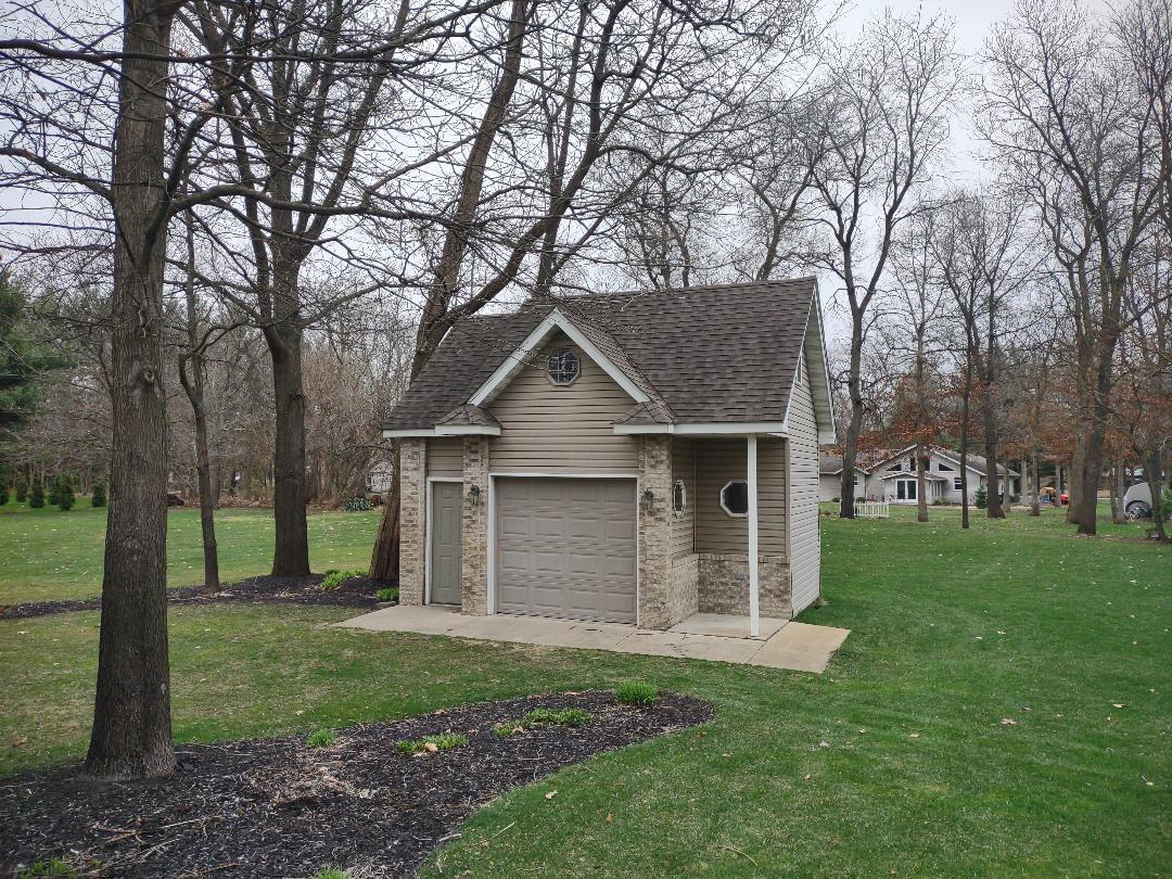 9800 Crestwood Circle Demotte, IN 46310 - Photo 4 of 25 a front view of house with a garden
