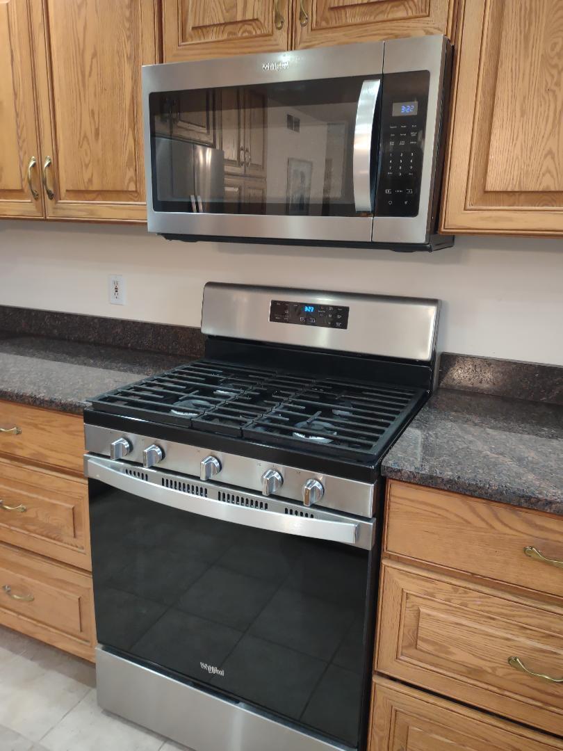 9800 Crestwood Circle Demotte, IN 46310 - Photo 8 of 25 a stove top oven sitting inside of a kitchen