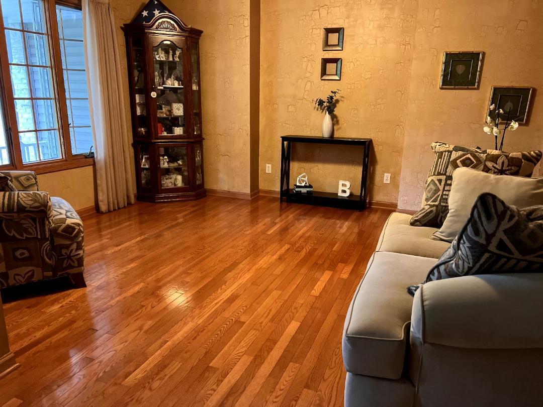 9800 Crestwood Circle Demotte, IN 46310 - Photo 9 of 25 a living room with furniture and a fireplace