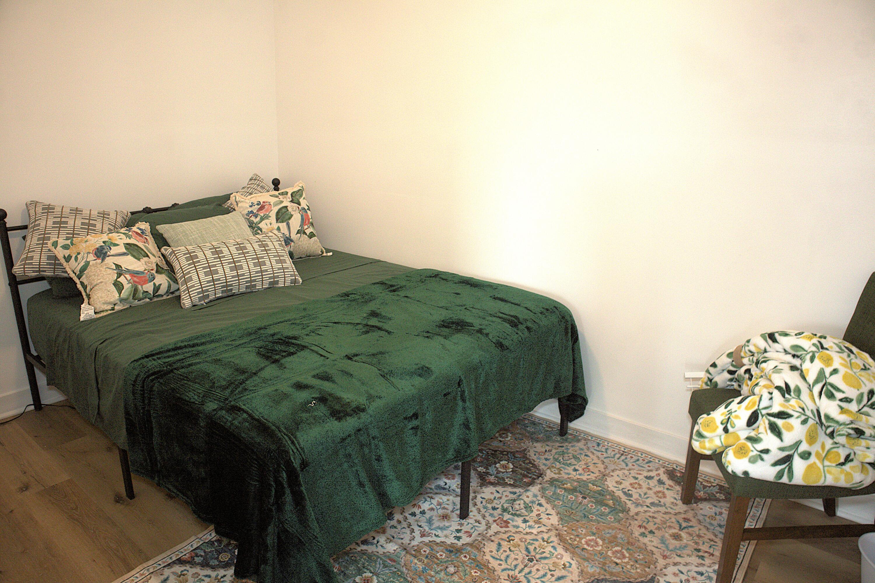 4001 Virginia Street Gary, IN 46409 - Photo 8 of 15 a bed sitting in a bedroom next to a window