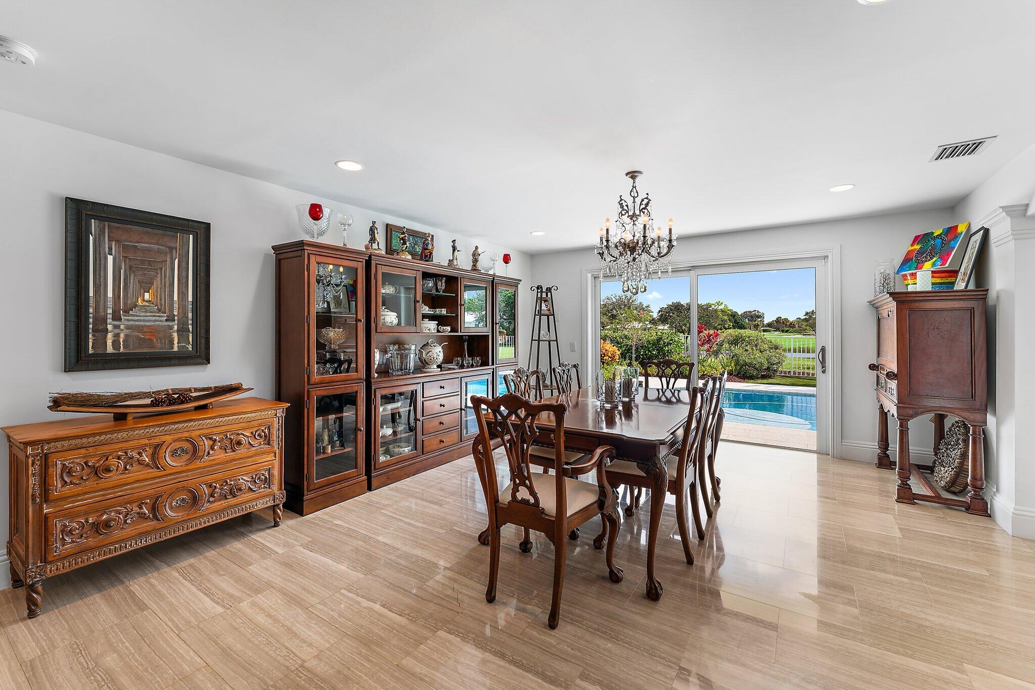 210 Golfview Drive Tequesta, FL 33469 - Photo 14 of 27 a view of a dining room with furniture window and wooden floor