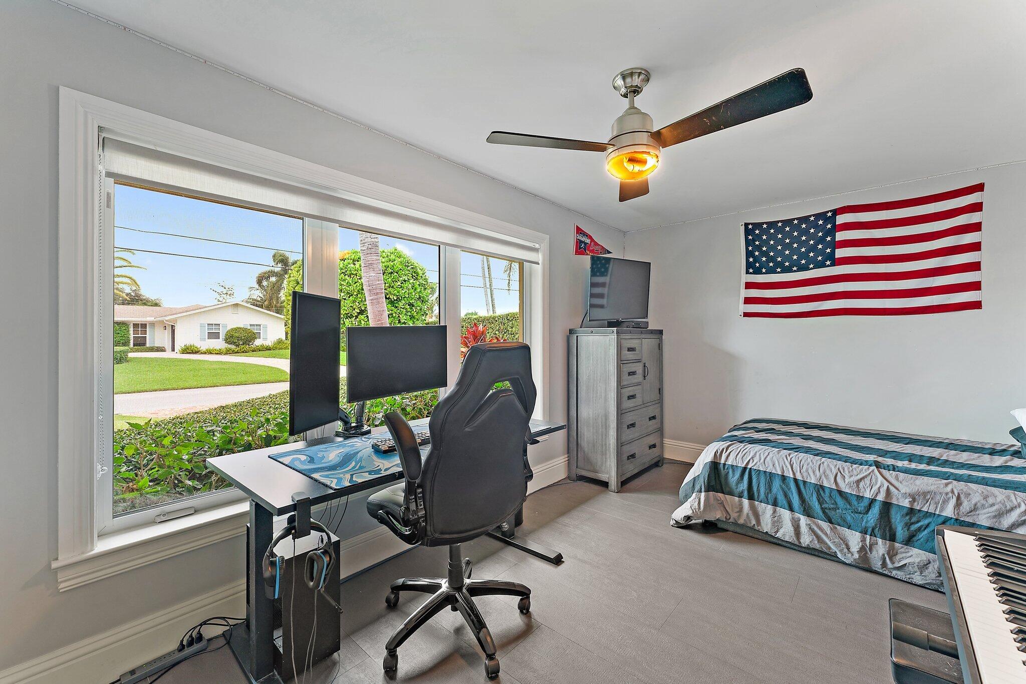 210 Golfview Drive Tequesta, FL 33469 - Photo 17 of 27 a view of a workspace with furniture and a window