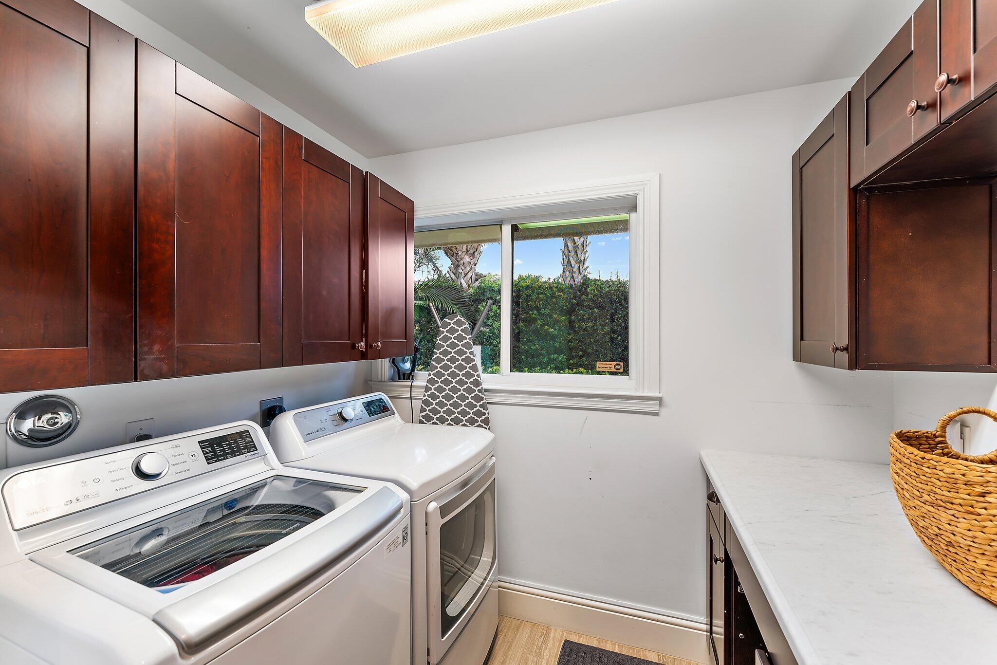 210 Golfview Drive Tequesta, FL 33469 - Photo 22 of 27 a utility room with dryer and washer