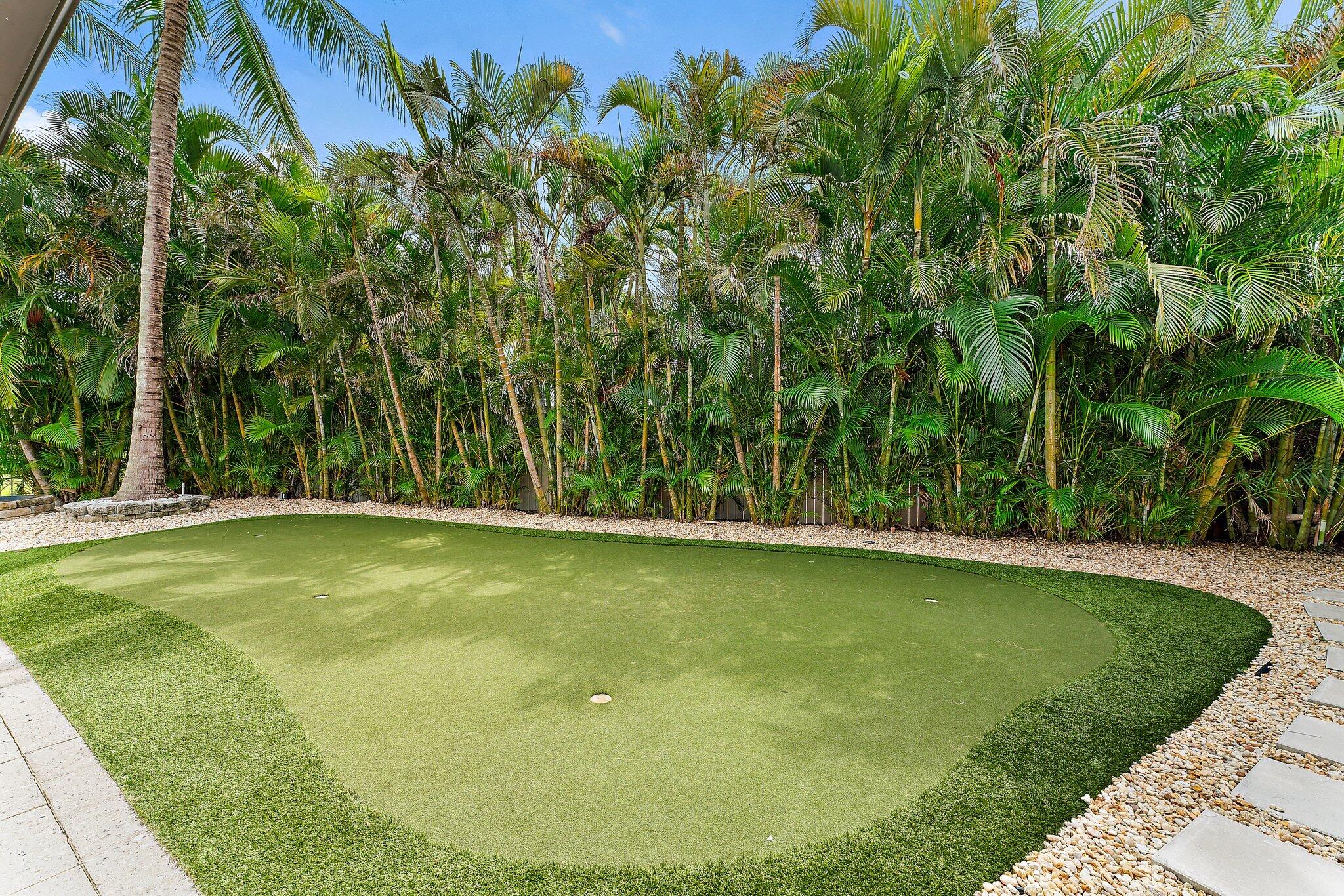210 Golfview Drive Tequesta, FL 33469 - Photo 24 of 27 a view of a swimming pool with an outdoor space