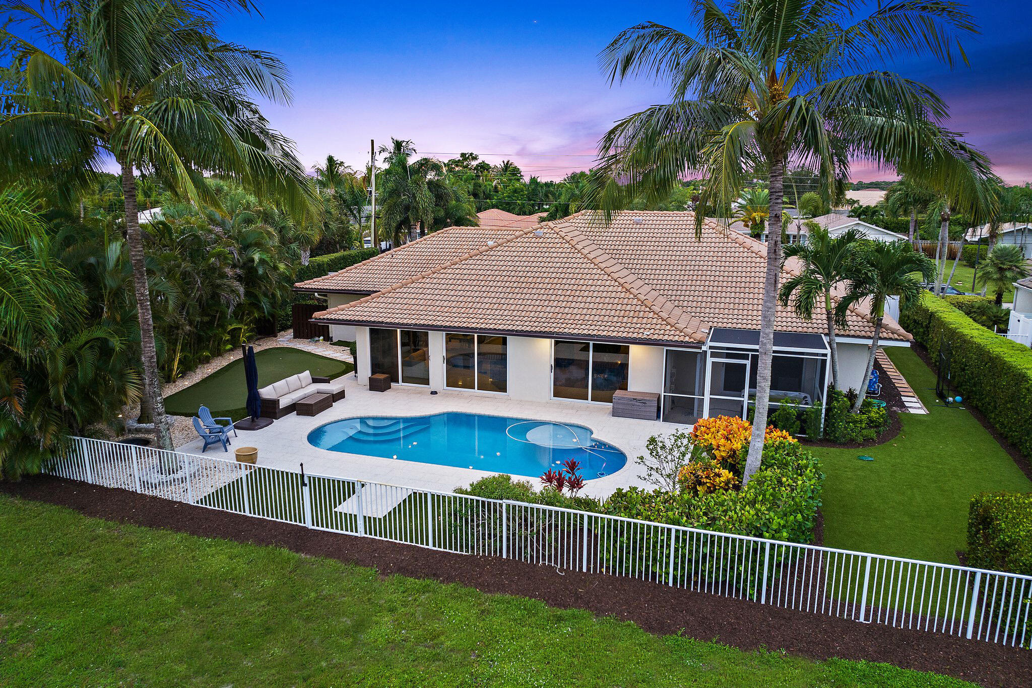 210 Golfview Drive Tequesta, FL 33469 - Photo 3 of 27 a view of a house with a yard and sitting area