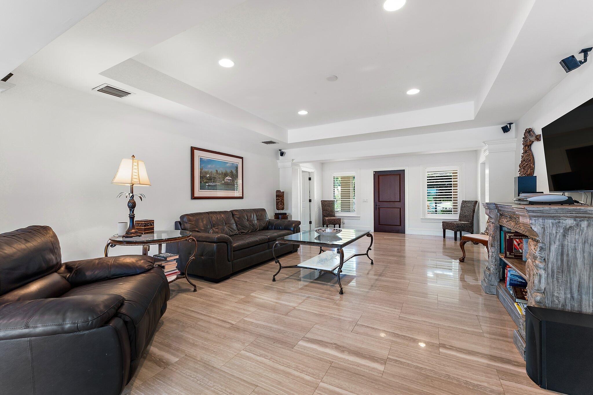 210 Golfview Drive Tequesta, FL 33469 - Photo 6 of 27 a living room with furniture and a flat screen tv