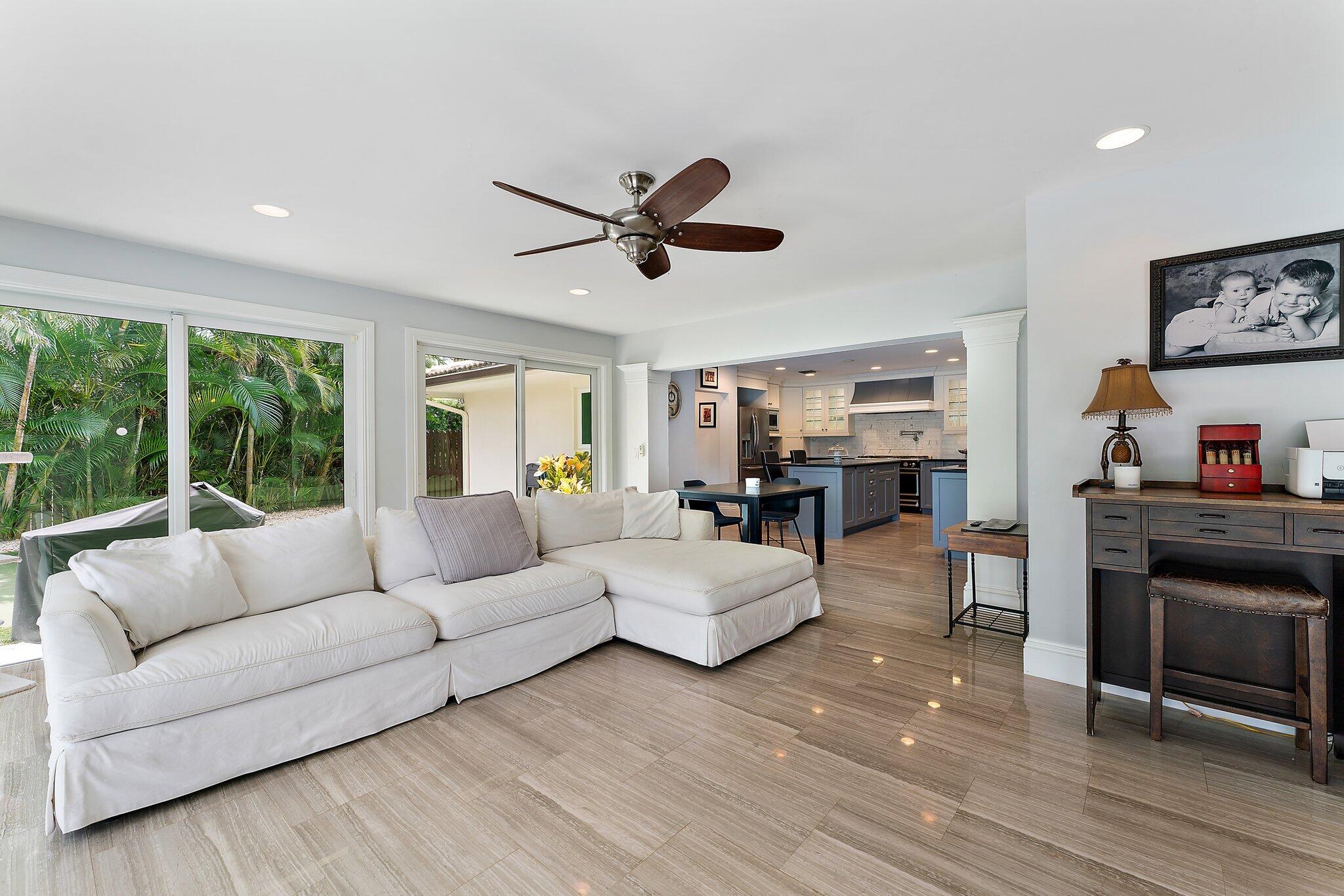 210 Golfview Drive Tequesta, FL 33469 - Photo 7 of 27 a living room with furniture and a large window