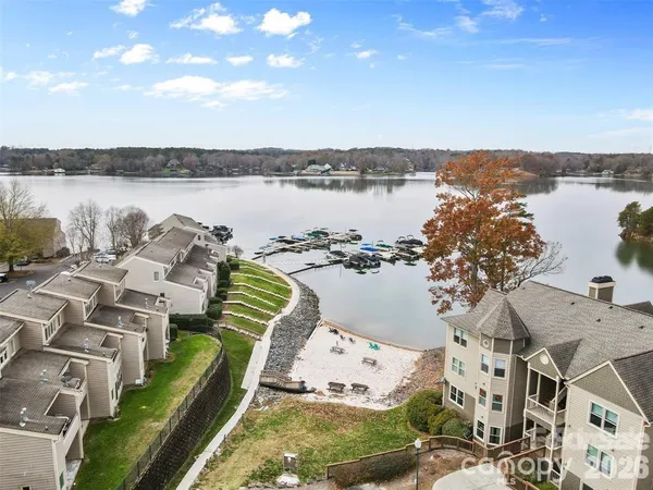 a view of a lake with couches in the patio