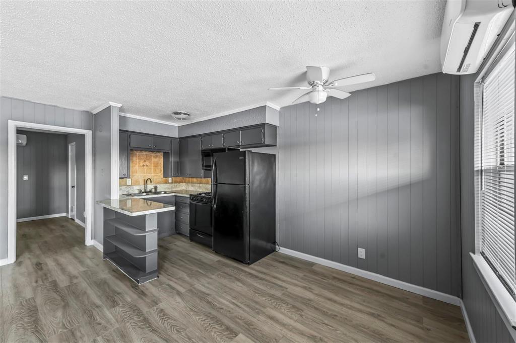 1585 North Mill Street, Unit 5 Lewisville, TX 75057 - Photo 4 of 17 a view of kitchen with sink refrigerator and window
