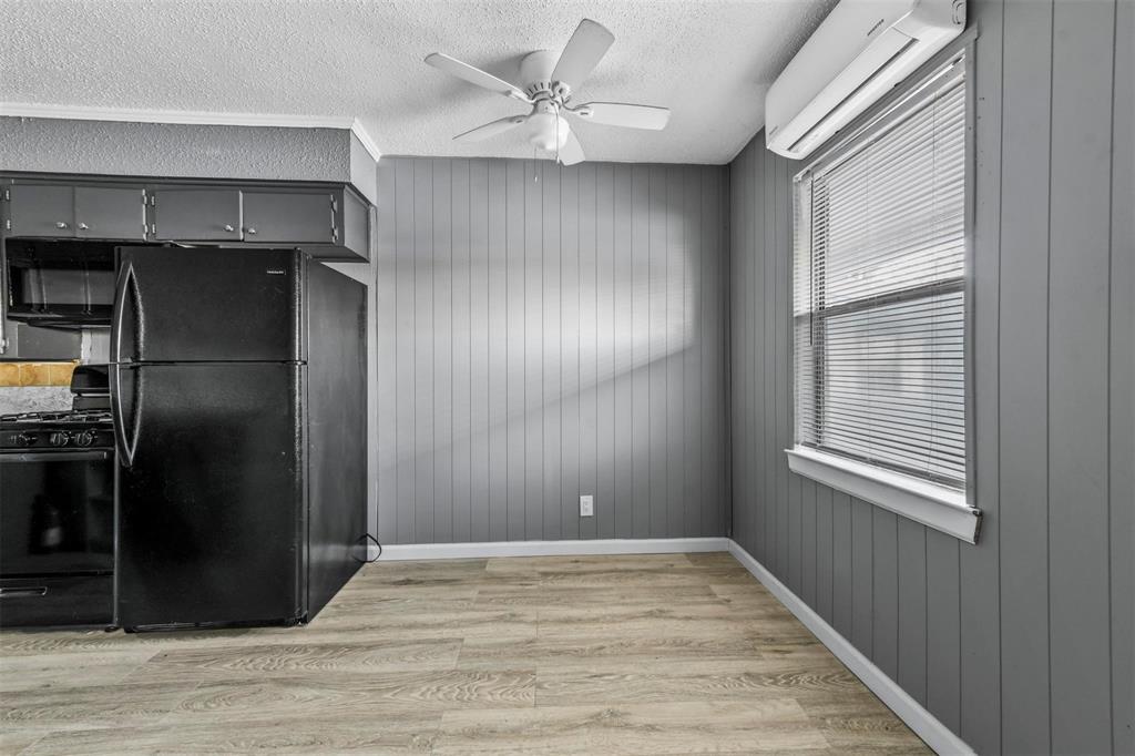 1585 North Mill Street, Unit 5 Lewisville, TX 75057 - Photo 8 of 17 a view of empty room with wooden floor
