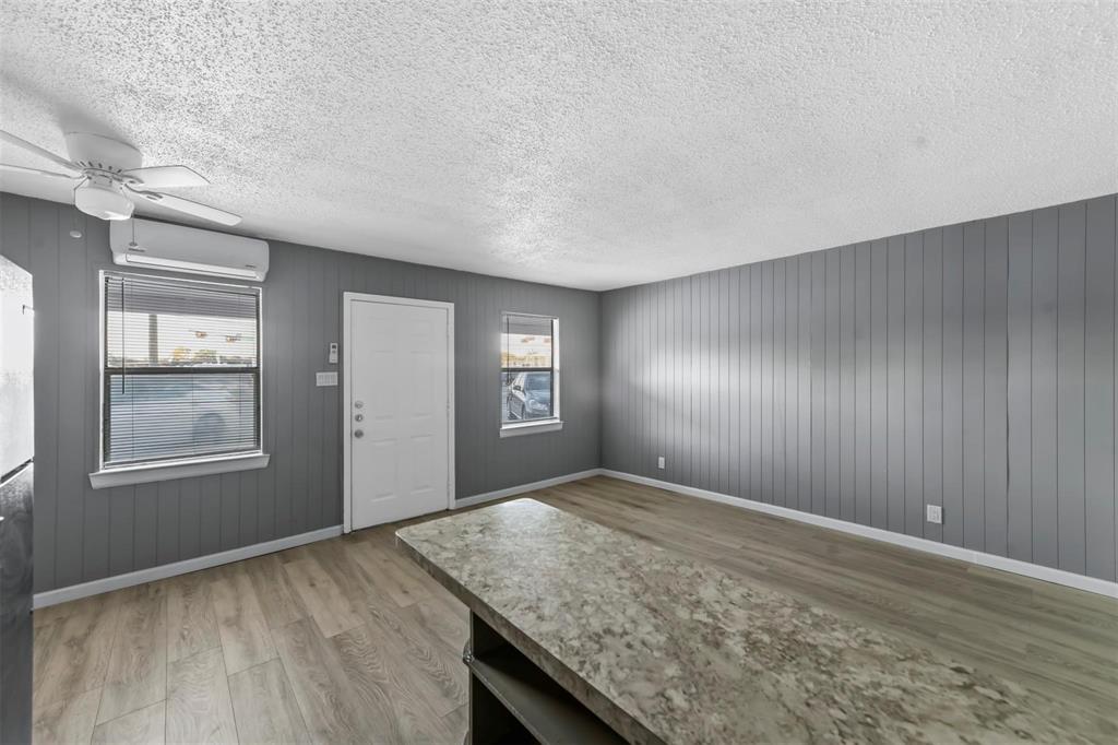 1585 North Mill Street, Unit 5 Lewisville, TX 75057 - Photo 9 of 17 an empty room with windows