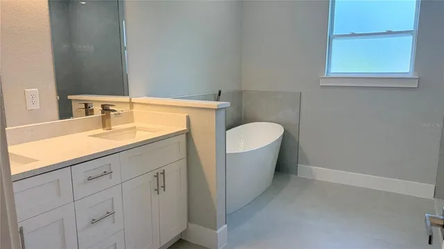 a bathroom with a sink and a bathtub