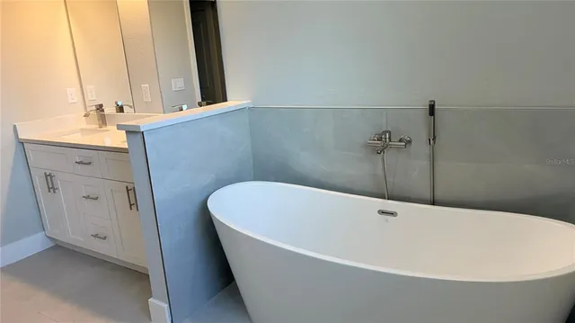 a white bath tub sitting in a bathroom
